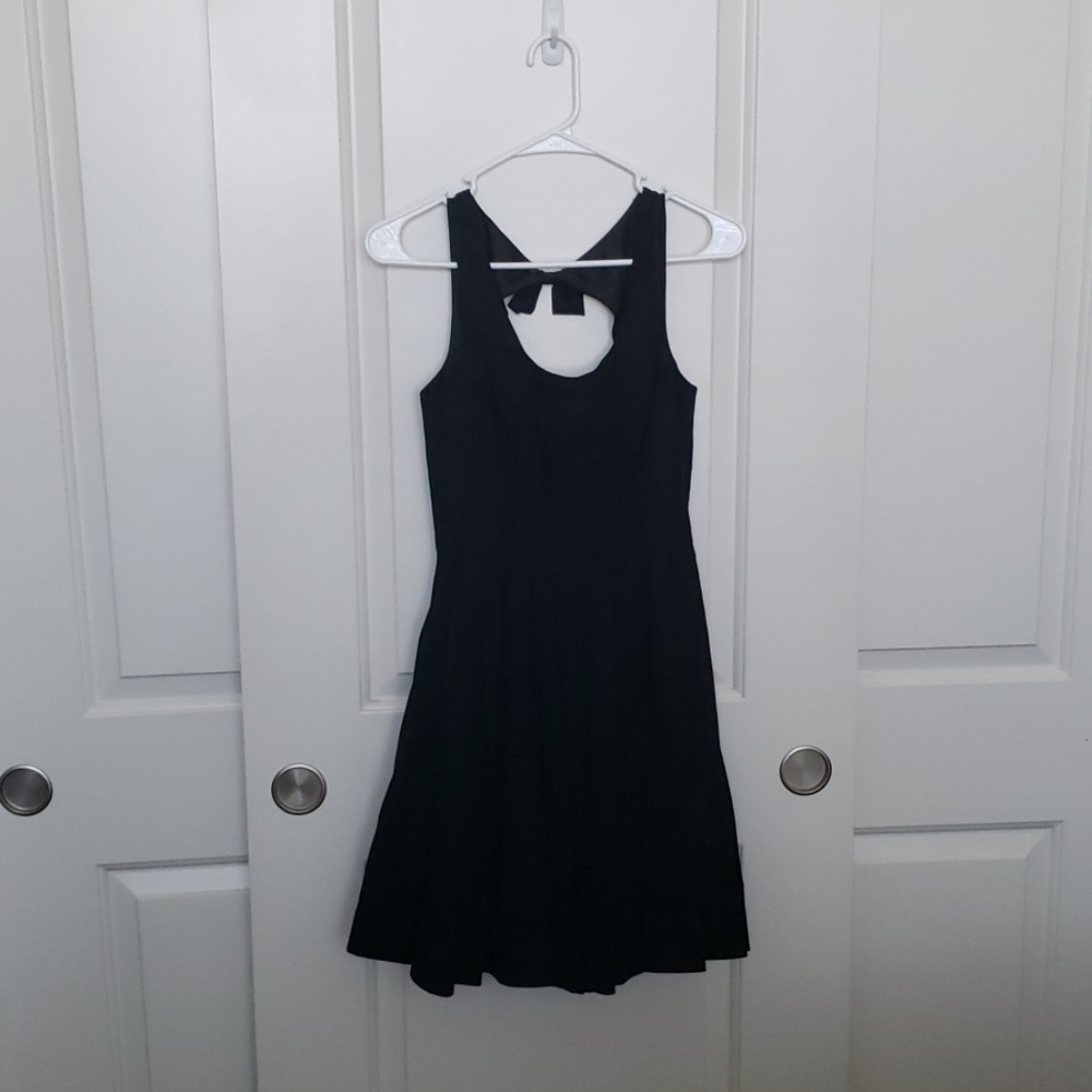 Black dress with back cutout and bow detail